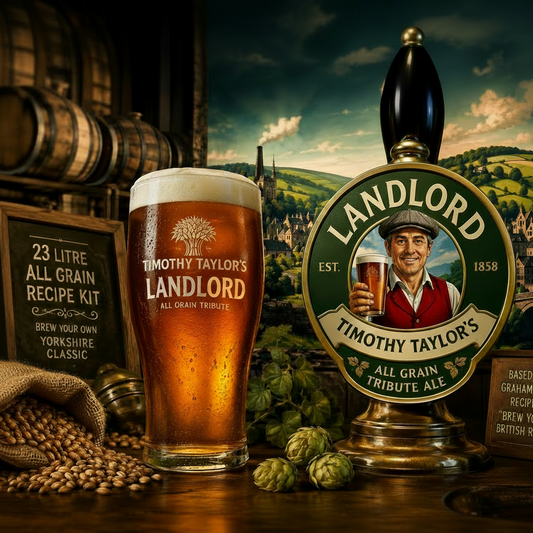 A pint of Timothy Taylor's Landlord All Grain Tribute Ale stands beside a Landlord beer tap handle in a rustic brewery setting with hops, grain, barrels, and a scenic backdrop. Timothy Taylors Landlord Tribute All Grain Recipe Kit